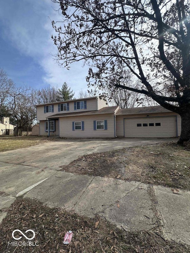 view of front of property with an attached garage and concrete driveway