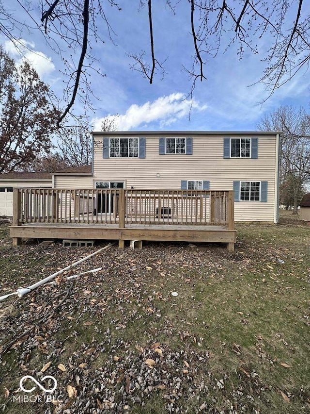 back of property with a deck