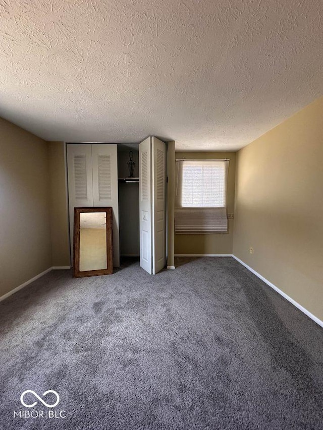 unfurnished bedroom with baseboards and carpet floors