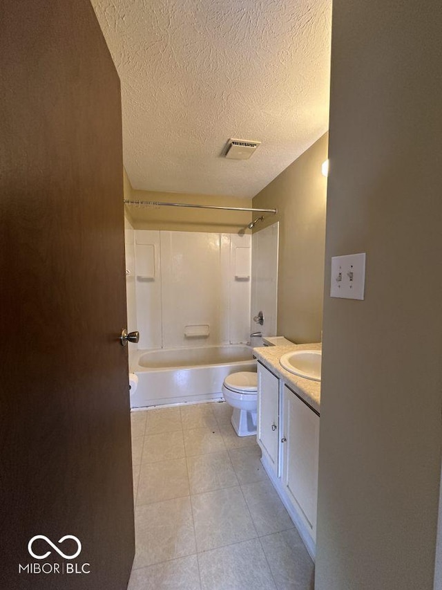 bathroom featuring visible vents, toilet, a textured ceiling, bathing tub / shower combination, and vanity