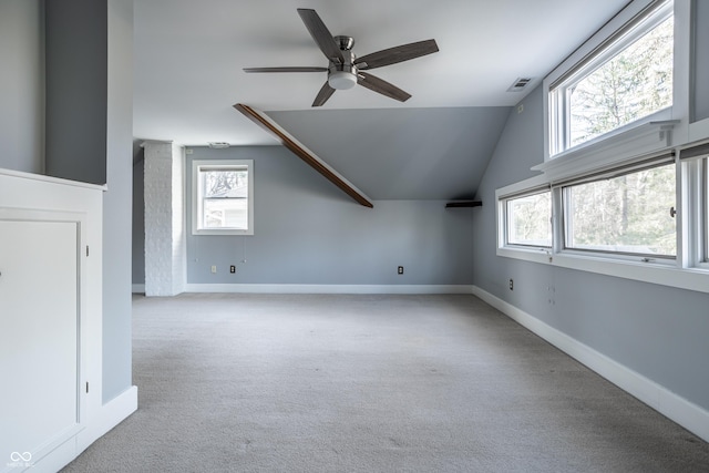 additional living space with visible vents, carpet floors, baseboards, and a ceiling fan