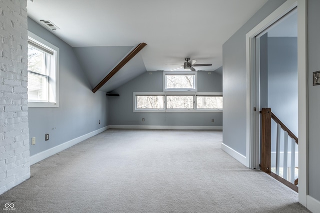 bonus room featuring visible vents, baseboards, ceiling fan, lofted ceiling, and carpet floors