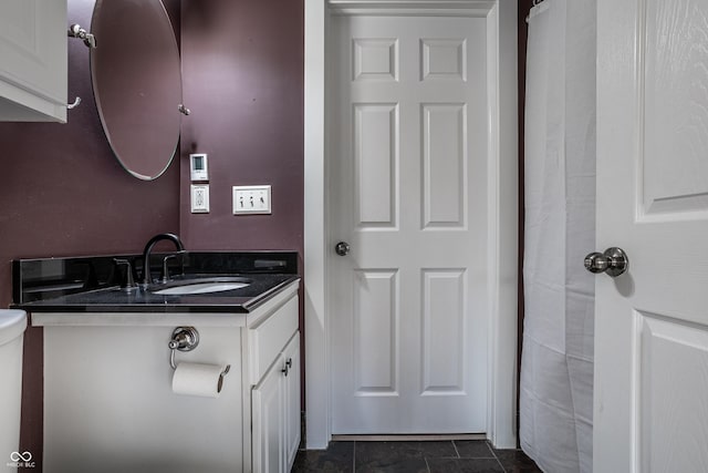 bathroom with toilet and vanity