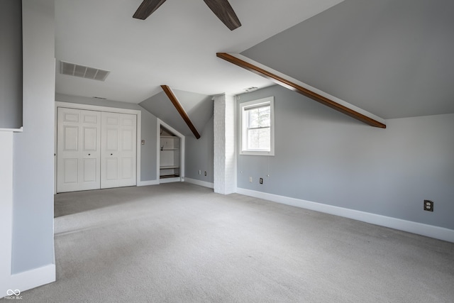 bonus room with lofted ceiling, carpet, visible vents, and ceiling fan