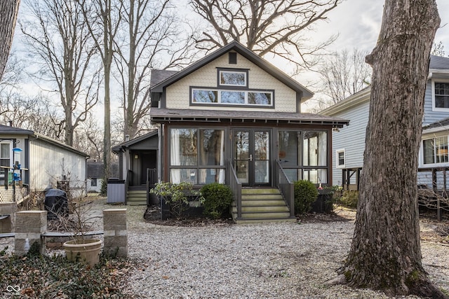 view of front of home featuring a sunroom