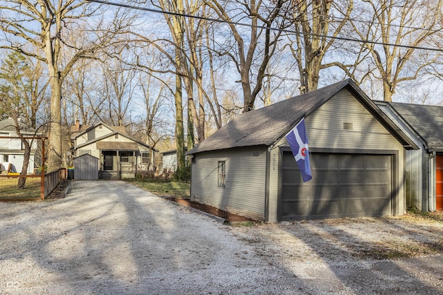 garage featuring fence