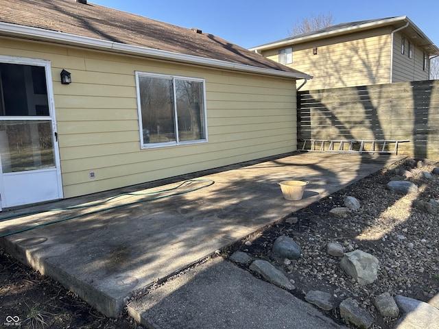 view of patio / terrace featuring fence