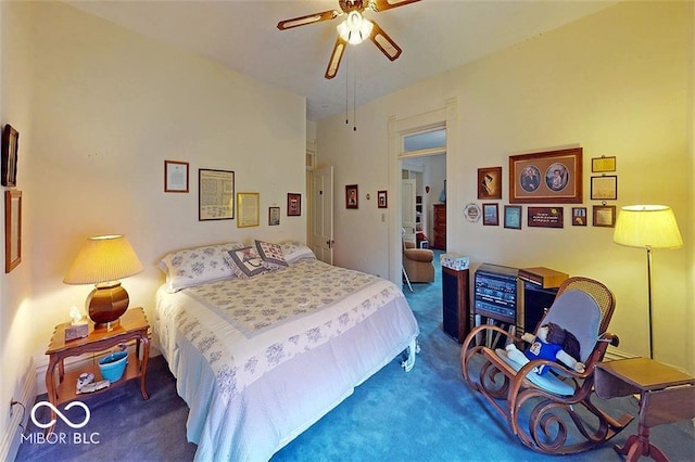 bedroom with ceiling fan and carpet flooring