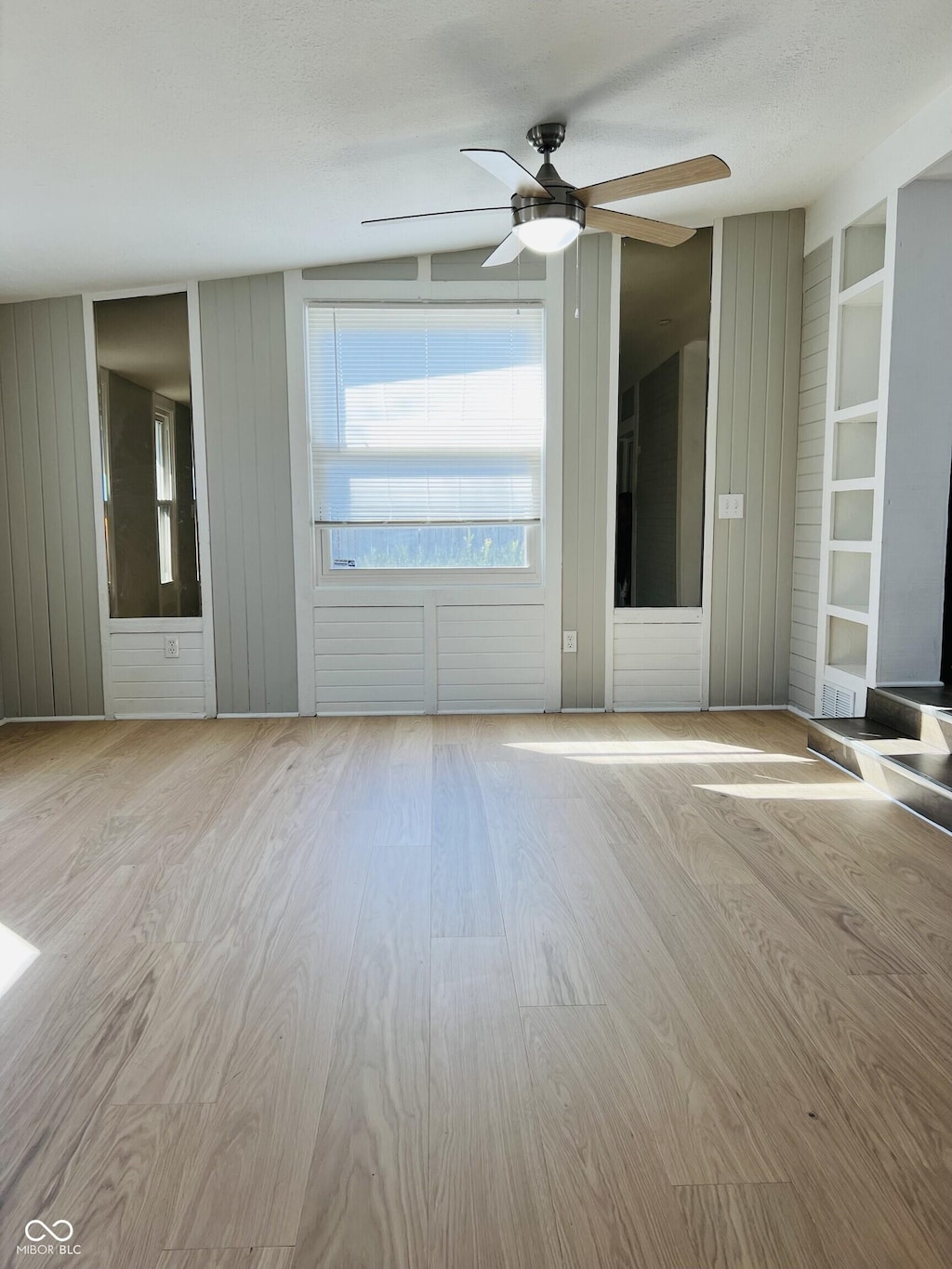 1607 Elmhurst Dr, Indianapolis, IN 46219 - spare room featuring ceiling fan and wood finished floors