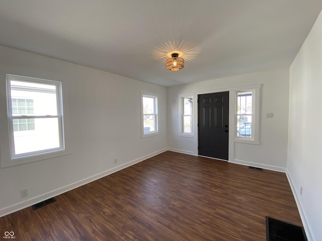 entryway with visible vents, dark wood-type flooring, and a healthy amount of sunlight