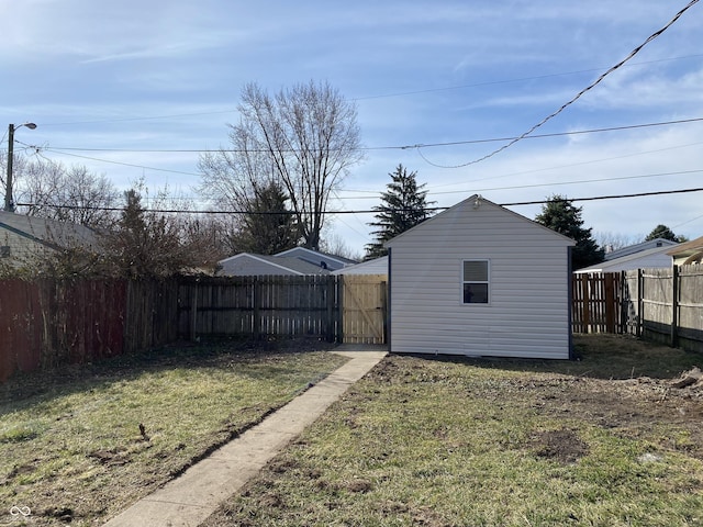 view of yard featuring an outdoor structure and a fenced backyard