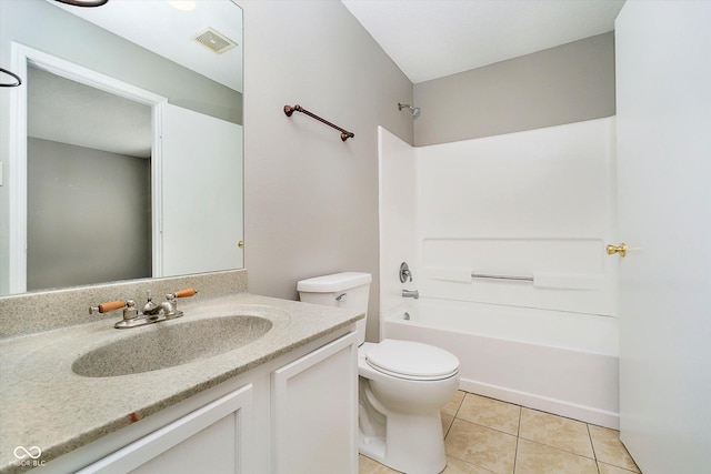 bathroom with tile patterned floors, visible vents, toilet, washtub / shower combination, and vanity