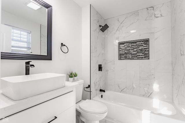 bathroom featuring shower / bathing tub combination, toilet, and vanity