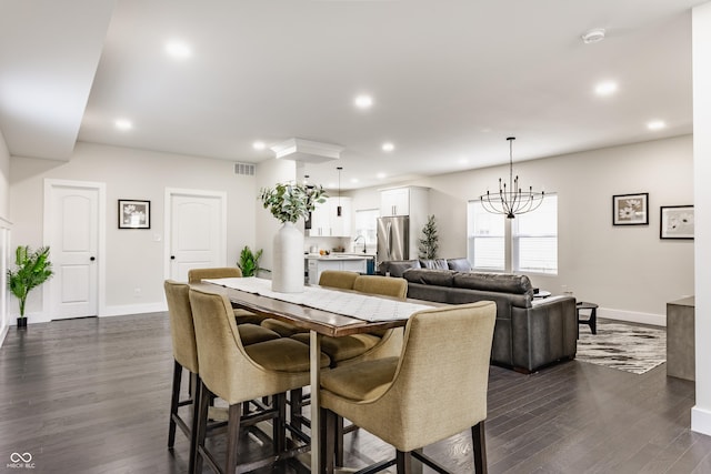 dining space with dark wood-type flooring, recessed lighting, visible vents, and baseboards