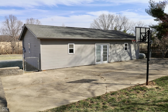 back of house featuring french doors, fence, a patio, and a gate