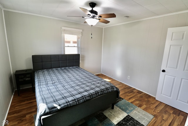 bedroom featuring wood finished floors, a ceiling fan, and ornamental molding