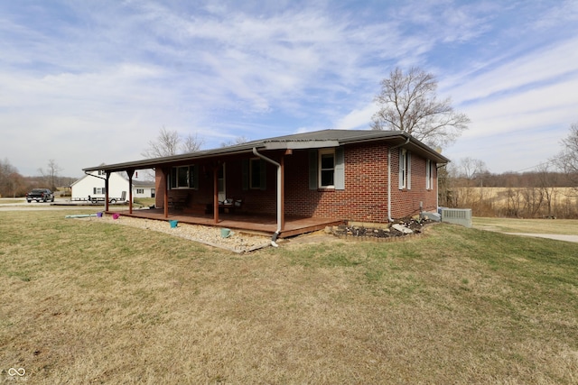 view of front of property with brick siding and a front lawn