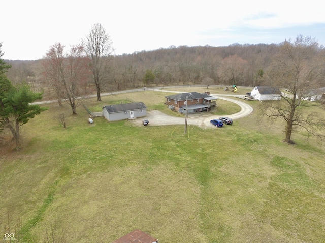 drone / aerial view featuring a forest view and a rural view