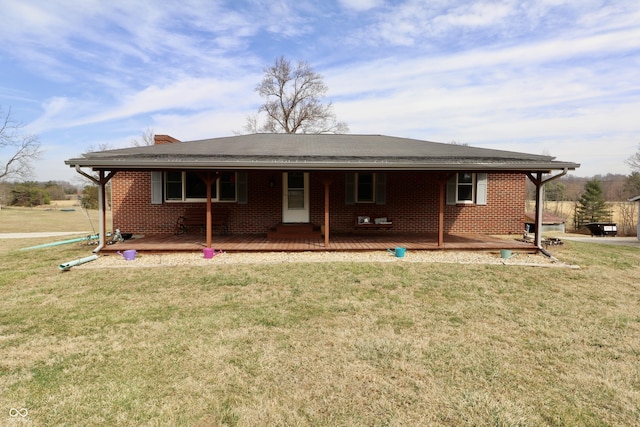 view of front of property with a front yard and brick siding