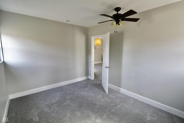 unfurnished bedroom with baseboards, a ceiling fan, and carpet flooring