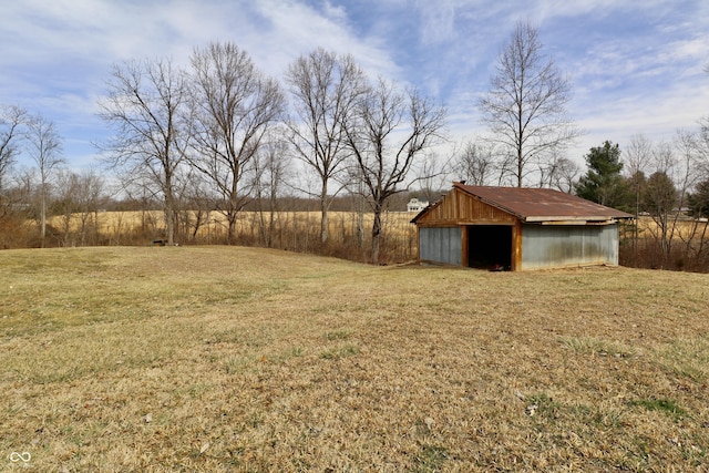 view of yard with an outbuilding and a pole building