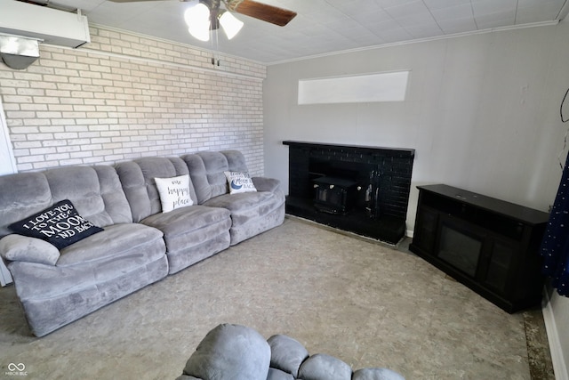 living room featuring ornamental molding, brick wall, and ceiling fan