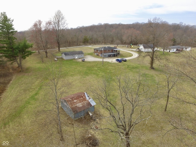 drone / aerial view with a rural view and a wooded view