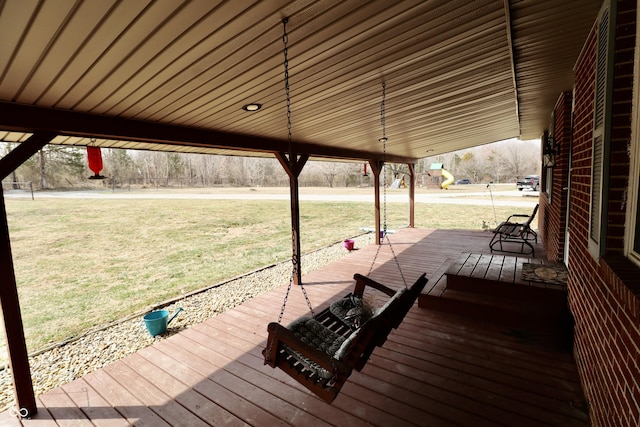 wooden deck with a lawn