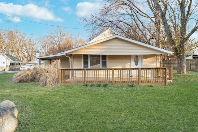 view of front facade with a front yard and fence