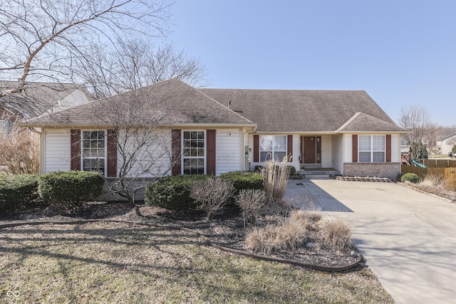 ranch-style house with brick siding and roof with shingles