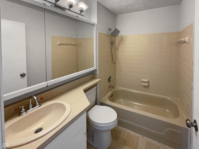 bathroom featuring toilet, a textured ceiling, vanity, and bathtub / shower combination