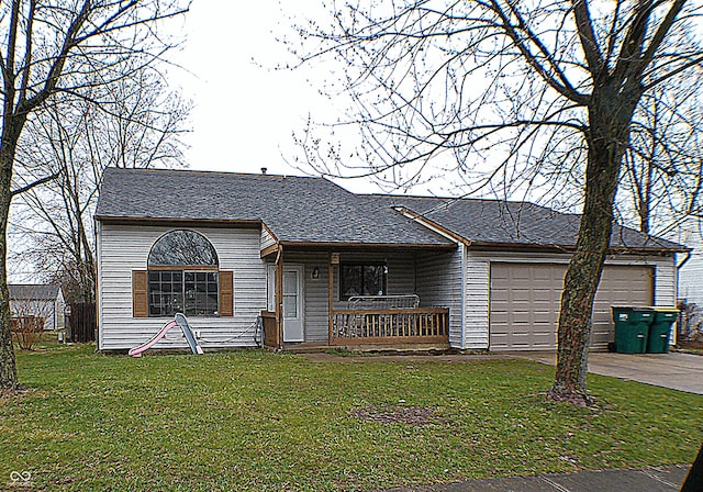 view of front of home featuring a garage, a front lawn, covered porch, and driveway