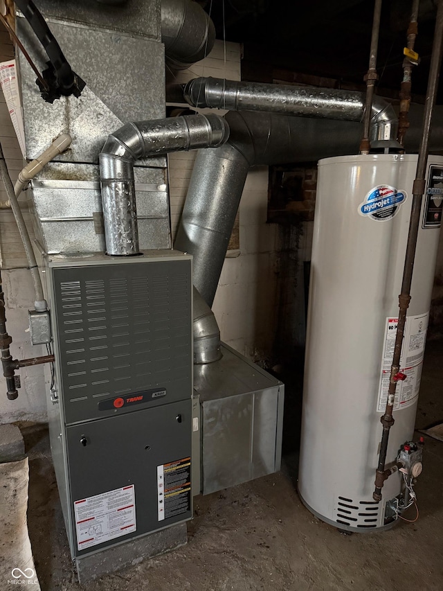 utility room featuring gas water heater