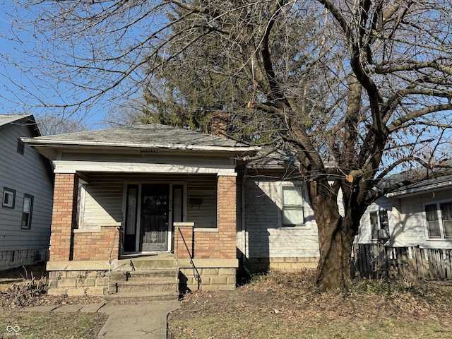 view of front of property with brick siding and a porch