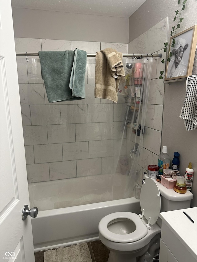 bathroom featuring tub / shower combination, toilet, and vanity