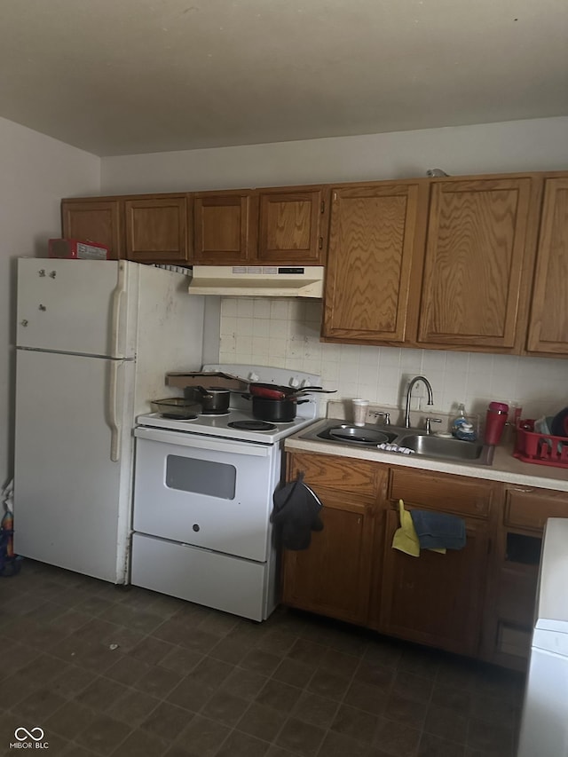 kitchen featuring a sink, under cabinet range hood, tasteful backsplash, white appliances, and brown cabinetry