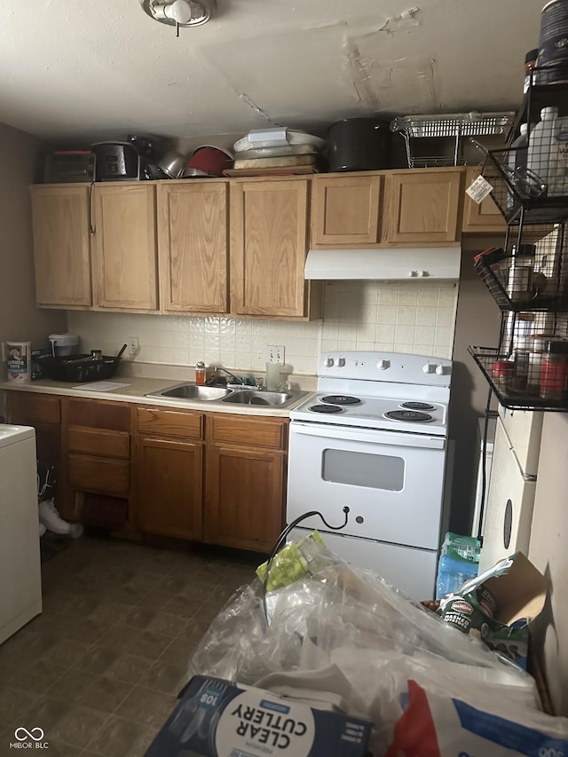 kitchen with white range with electric cooktop, a sink, light countertops, under cabinet range hood, and backsplash