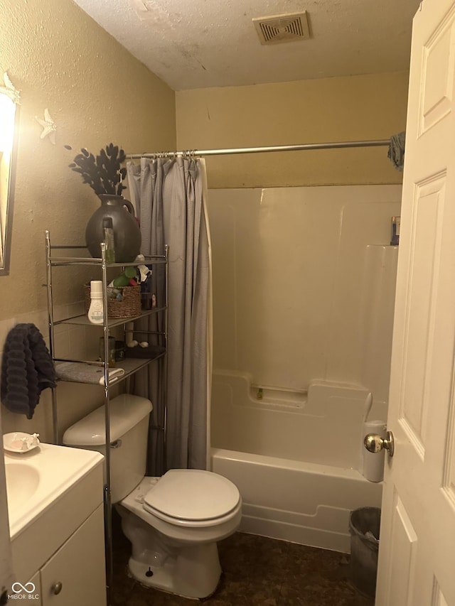 bathroom featuring vanity, visible vents, shower / bath combo with shower curtain, a textured ceiling, and toilet