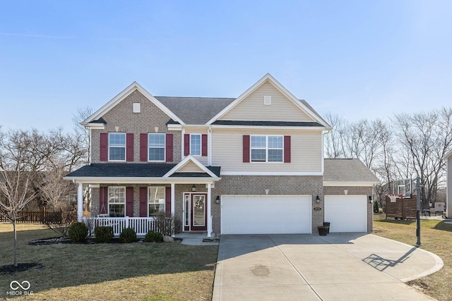 view of front of home with a porch, brick siding, driveway, and a front lawn