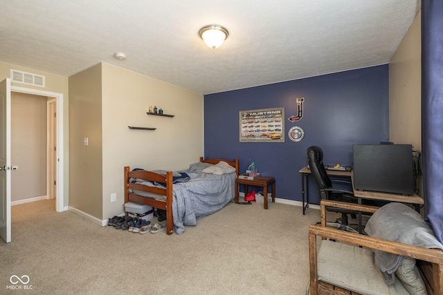 carpeted bedroom featuring visible vents, baseboards, and a textured ceiling