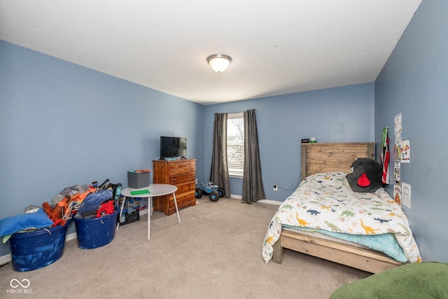 carpeted bedroom with baseboards