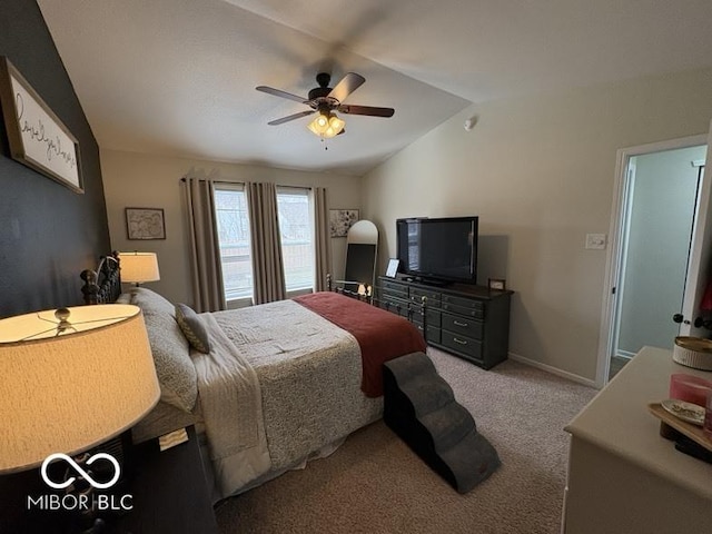 carpeted bedroom featuring lofted ceiling, a ceiling fan, and baseboards