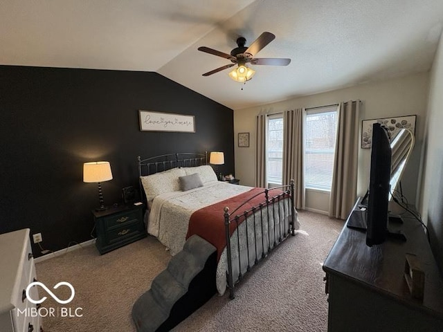 bedroom with baseboards, a ceiling fan, lofted ceiling, and carpet floors