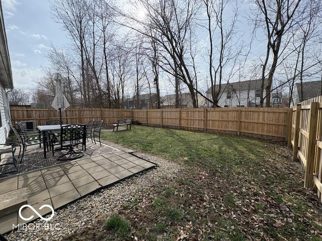 view of yard featuring a patio area, cooling unit, and a fenced backyard