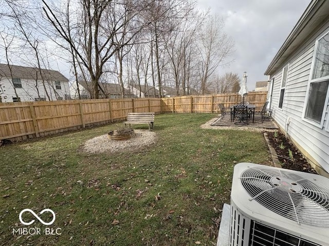 view of yard with a patio, cooling unit, and a fenced backyard