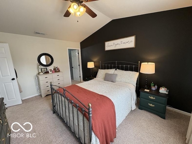 bedroom featuring a ceiling fan, visible vents, baseboards, vaulted ceiling, and light colored carpet