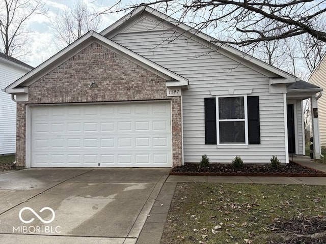 single story home featuring concrete driveway, a garage, and brick siding