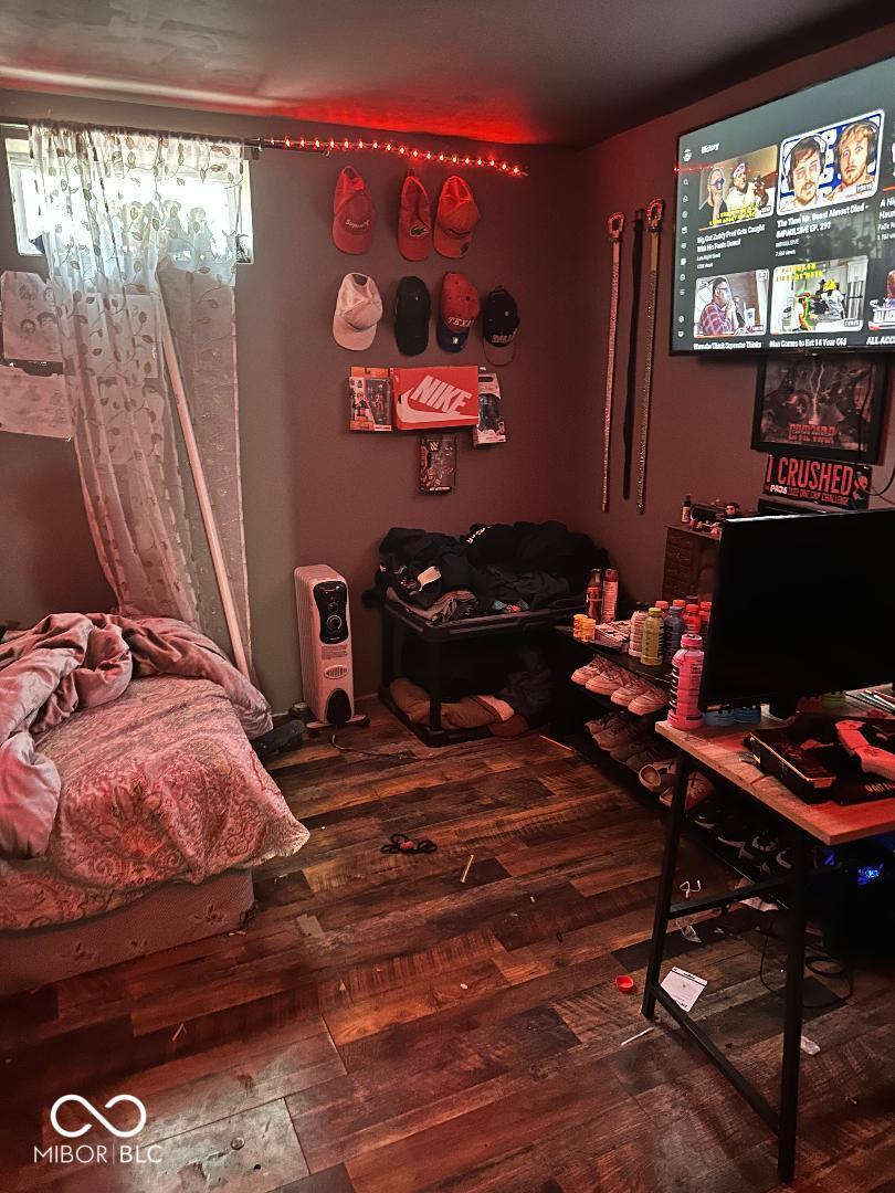 bedroom featuring wood finished floors