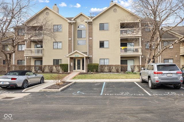 view of property featuring uncovered parking