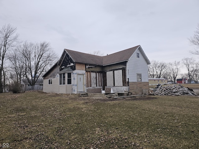 view of home's exterior with a lawn